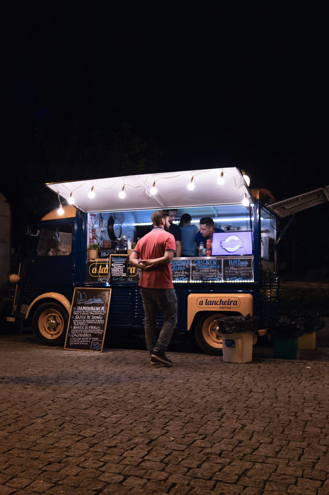 People queuing at a street food truck on Copenhagen's Reffen waterfront